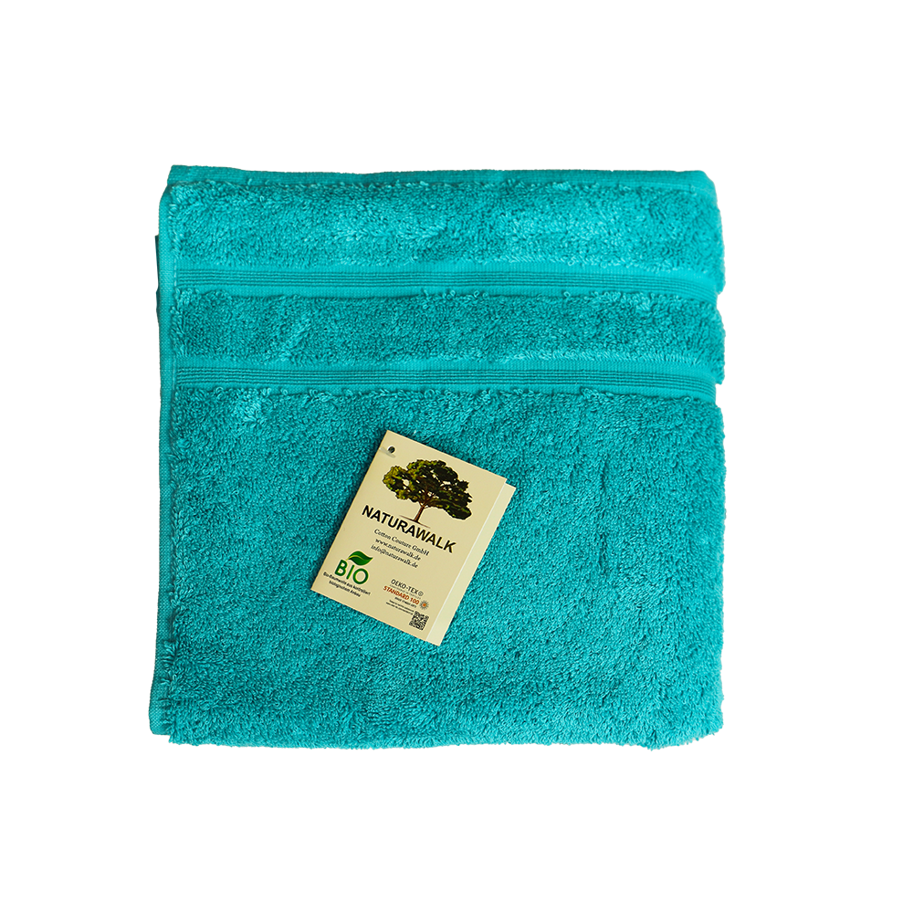 Ein Handtuch von NATURAWALK aus 100 Prozent Bio-Baumwolle in der Groesse 50x100cm. Farbe Tuerkis. Modell Milano Deluxe Sea.