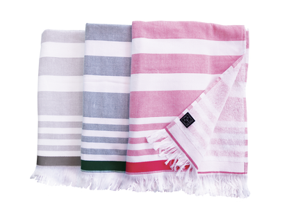 Drei Hamam-Wellnesstuecher von CARL COTTON in drei verschiedenen Farben.