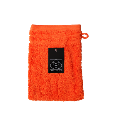 Ein Waschhandschuh von CARL COTTON aus 100 Prozent Baumwolle in der Groesse 16x21cm. Farbe Orange. Modell Trend Orange.