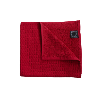 Ein Handtuch von CARL COTTON aus 100 Prozent Baumwolle in der Groesse 50x100cm. Farbe Bordeaux. Modell Waffelpique Kirsche.