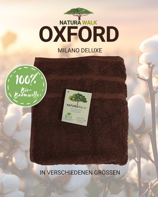 Ein Handtuch von NATURAWALK aus 100 Prozent Bio-Baumwolle in der Farbe Braun. Modell Milano Deluxe Oxford. 