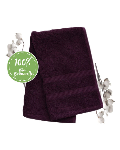 Ein Gaestetuch von NATURAWALK aus 100 Prozent Bio-Baumwolle in der Groesse 30x50cm. Farbe Lila. Modell Milano Deluxe Plum.