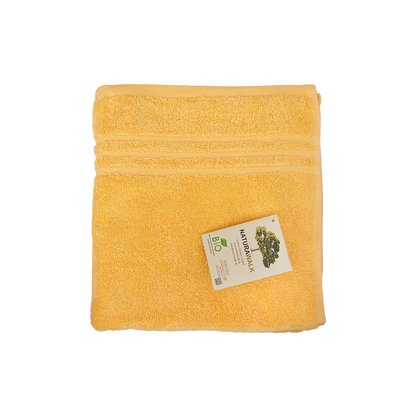 Ein Handtuch von NATURAWALK aus 100 Prozent Bio-Baumwolle in der Groesse 50x100cm. Farbe Gelb. Modell Milano Exclusiv Gelb.