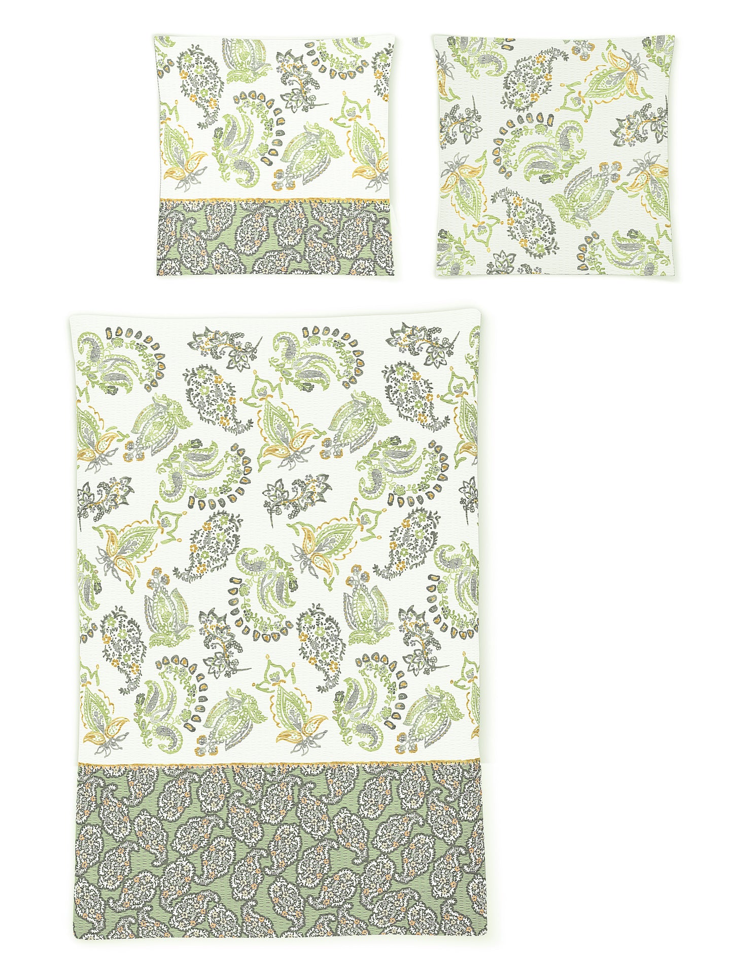 Zwei Kopfkissen und eine Bettdecke bezogen mit Soft Seersucker Bettwaesche mit einem Muster aus Ornamenten in der Farbe Gruen. Modell Shadow Green.