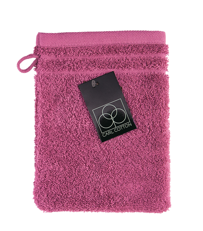 Ein Waschhandschuh von CARL COTTON aus 100 Prozent Baumwolle in der Groesse 16x21cm. Farbe Pink. Modell Trend Fuchsia.