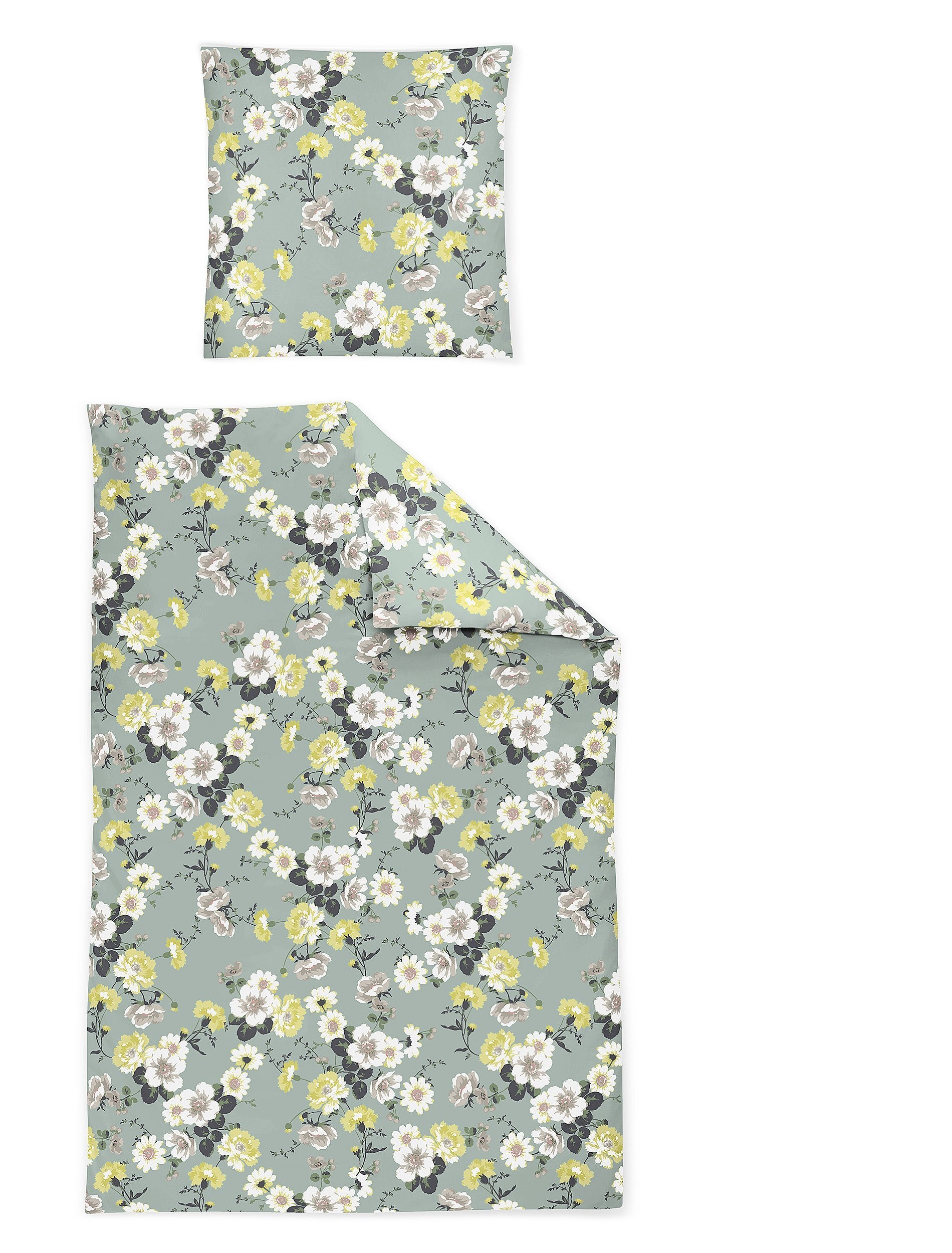 Ein Kopfkissen und eine Bettdecke bezogen mit Satin Bettwaesche mit einem Muster aus Blumen in der Farbe Mint. Modell Blumen Mint.