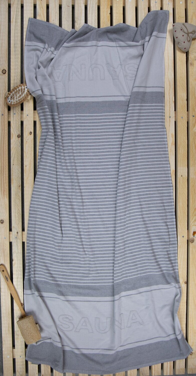 Ein Saunatuch von en Vogue aus 100 Prozent Baumwolle in der Groesse 90x180cm. Farbe Grau.